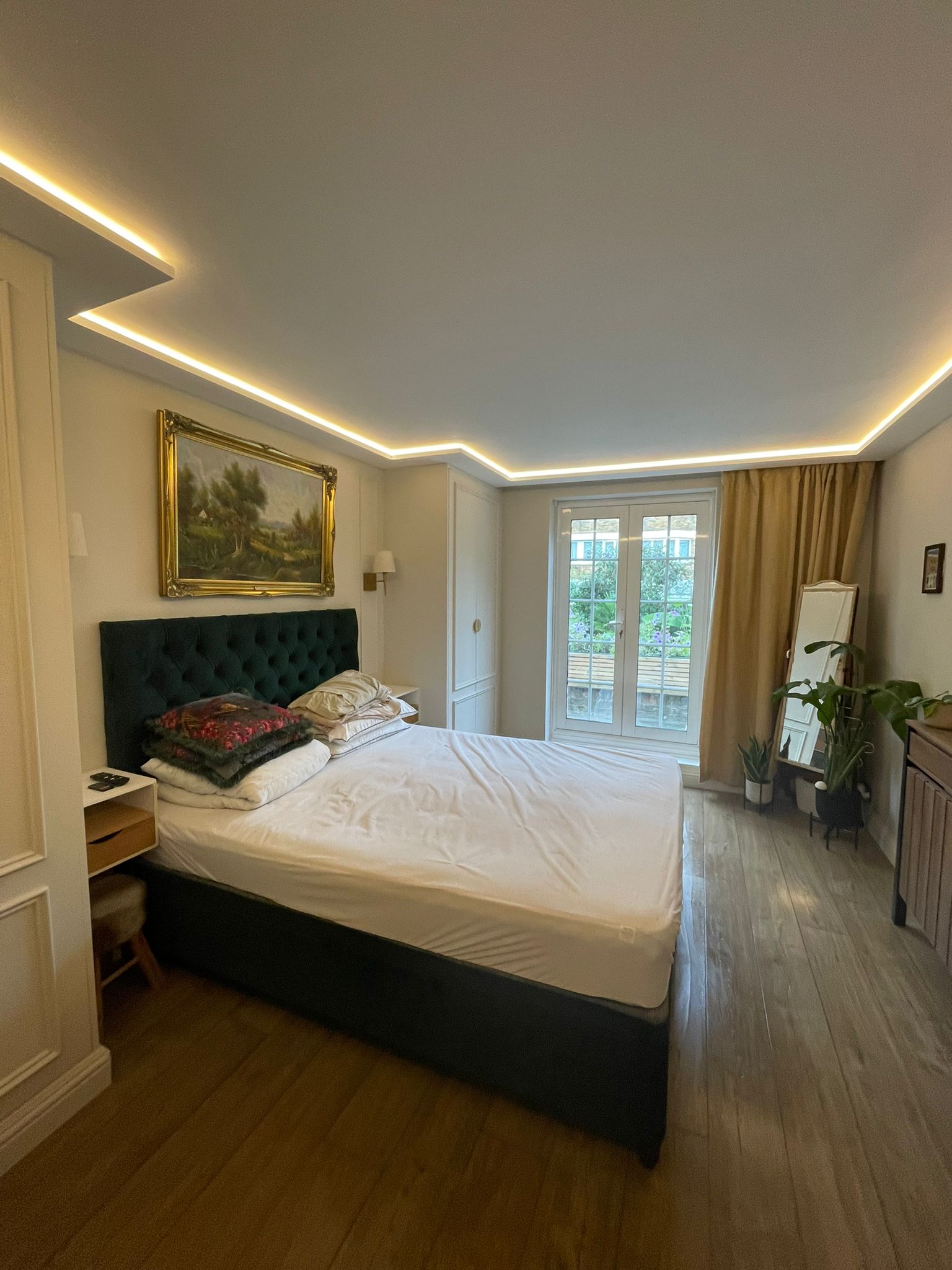 A cozy bedroom with a large bed and window