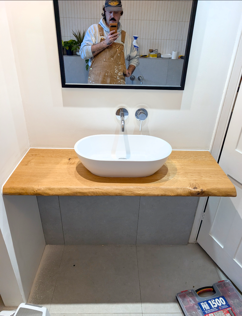 Man taking a selfie in bathroom