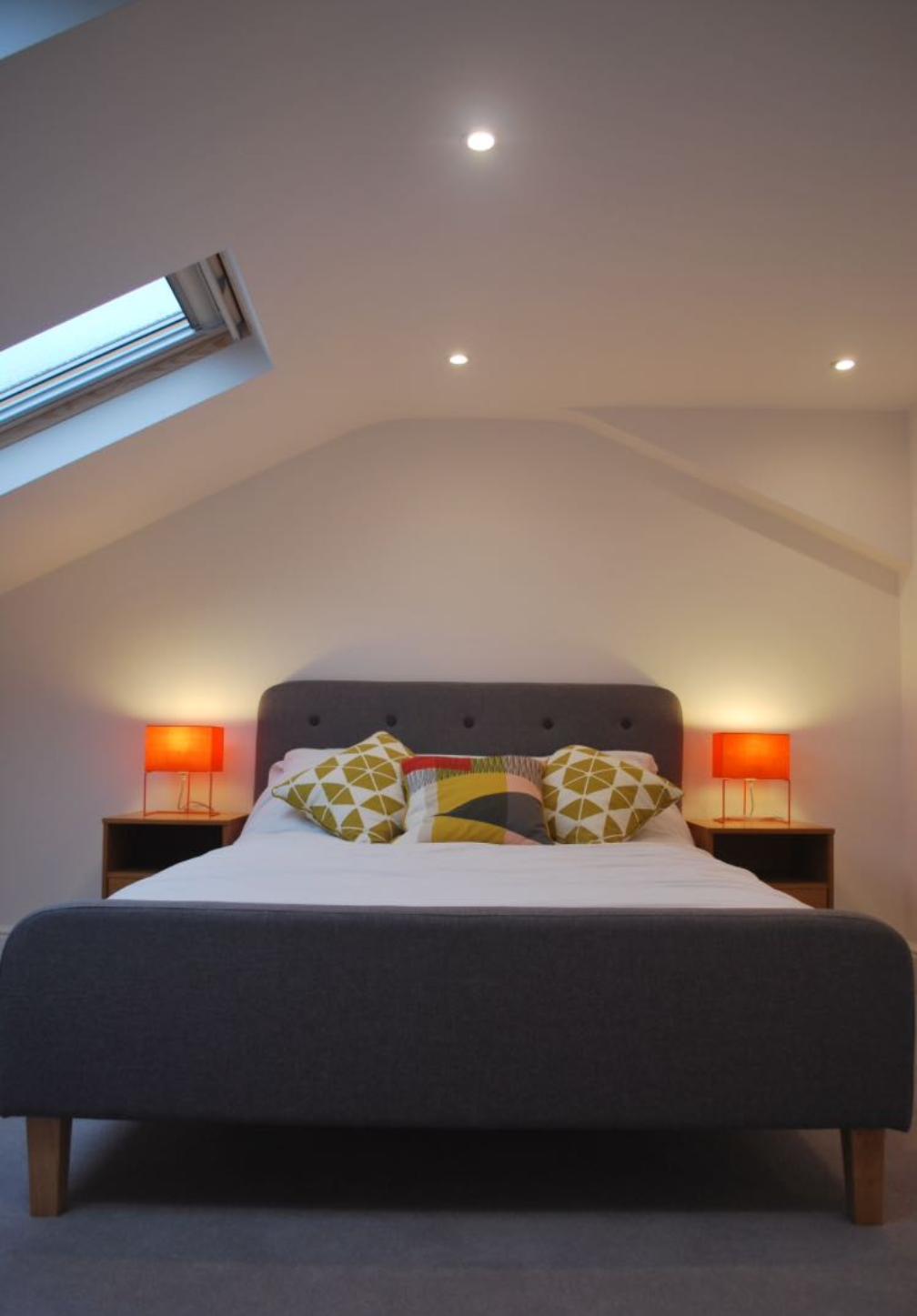 Attic bedroom with skylight and double bed
