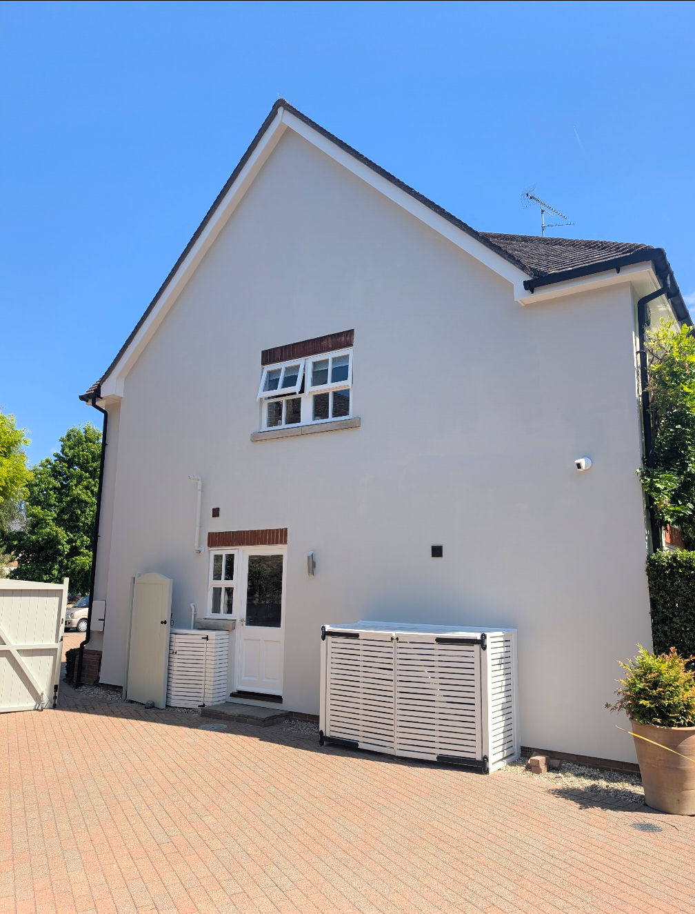 Side of house with outdoor units